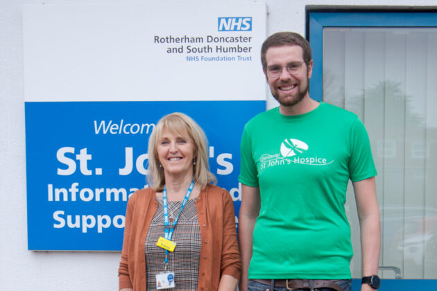 Man with St John's Hospice t-shirt next to a woman.