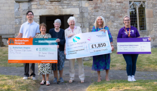 Three groups of people each holding cheques for £1,850