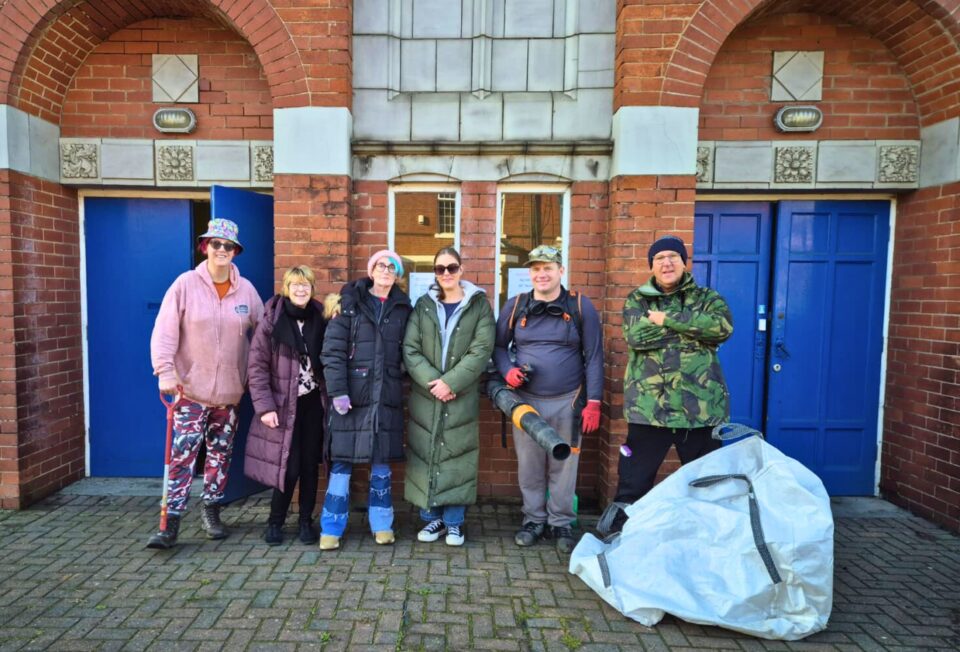 Group of people outside Alder Grove Methodist Church.