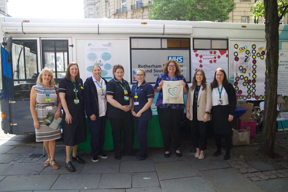 People stood around a bus
