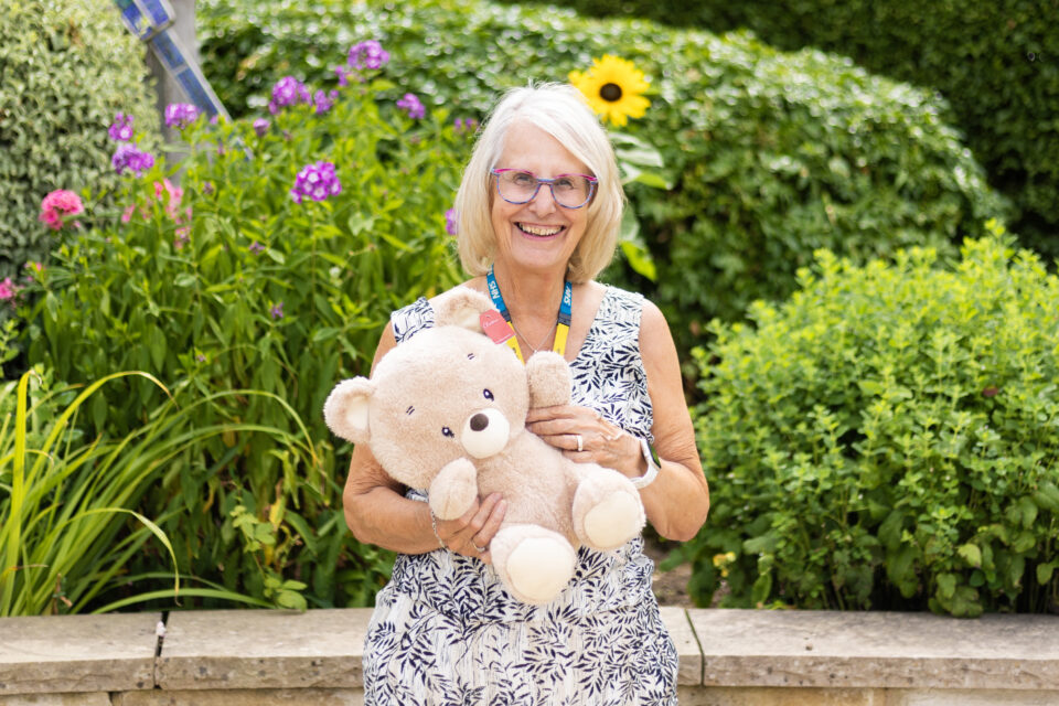 Maureen Harwood holding a teddy bear